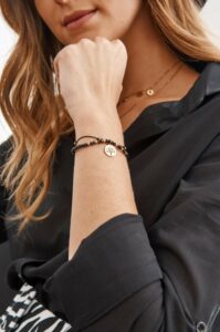 A delicate bracelet with a black