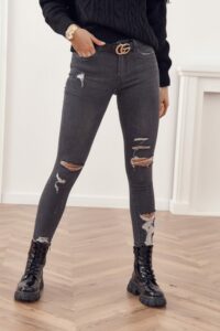 Fashionable denim pants with holes in the front