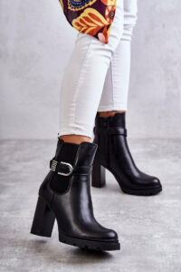 leather boots on a post with a decorative belt Black